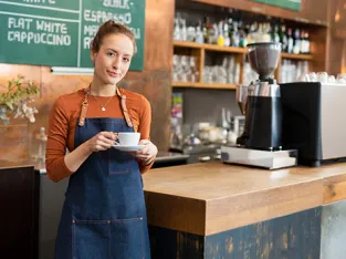 A barista in a coffee shop
