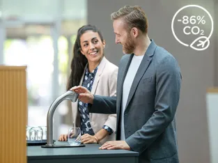 2 colleagues meeting at a BRITA water dispenser